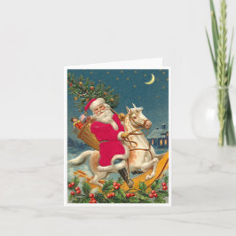 Tarjeta Santa Claus on a wooden horse