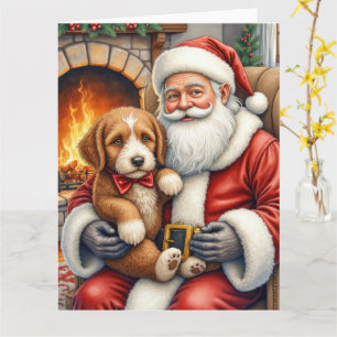 Tarjeta Santa Claus sosteniendo arte de Navidad de Bernedo