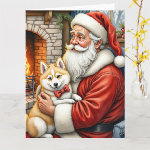 Tarjeta Santa Claus sosteniendo arte navideño de esquimal 