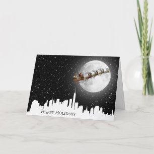 Tarjeta Santa y Sleigh sobrevolando la ciudad