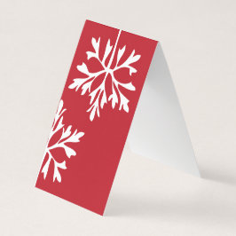 Tarjeta Sencillo copo de nieve sobre el fondo rojo