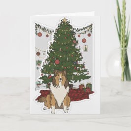 Tarjeta Sheltie junto al árbol de Navidad