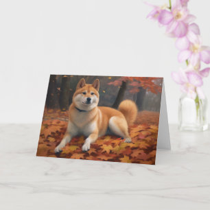 Tarjeta Shib Inu en hojas de otoño caídas inspira