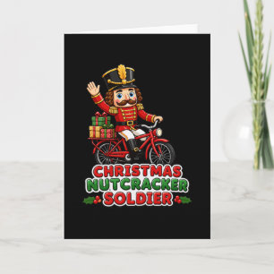 Tarjeta Soldado Cascanueces de Navidad montando bicicleta