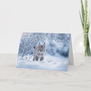 Tarjeta Solsticio de invierno con gato montés y nieve