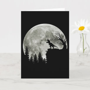 Tarjeta T Rex de pie en la montaña Halloween bajo la luz d
