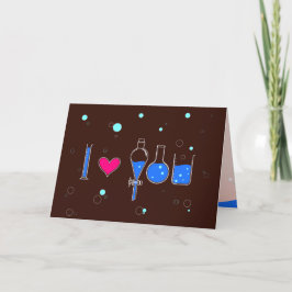 Tarjeta "Te amo" deletreado por cristalería, texto persona