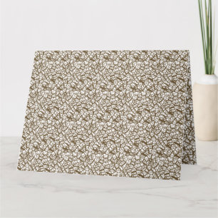 Tarjeta Una alfombra marrón con un motivo geométrico es pa