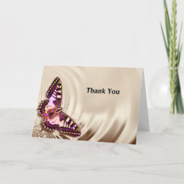 Tarjeta Una mariposa rosa sobre un fondo de satén crema