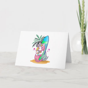 Tarjeta Unicornio con tablas de surf en la playa
