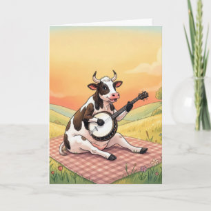 Tarjeta Vaca de cumpleaños tocando un banjo en una manta