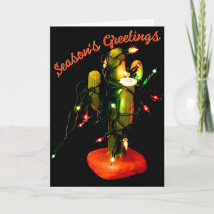 Tarjeta Vela de cactus envuelta en luces de Navidad