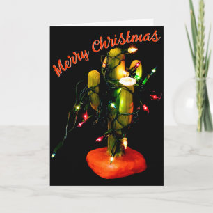 Tarjeta Vela de cactus envuelta en luces de Navidad