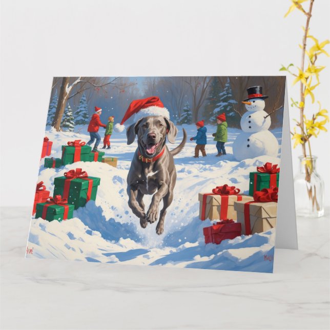 Tarjeta Weimaraner corre en Nieve con Gorra Navidad (flor amarilla)