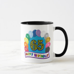 Taza 65.o cumpleaños feliz con los globos