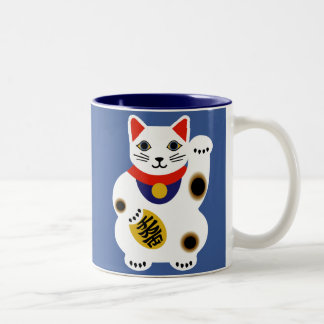 Taza afortunada azul del gato