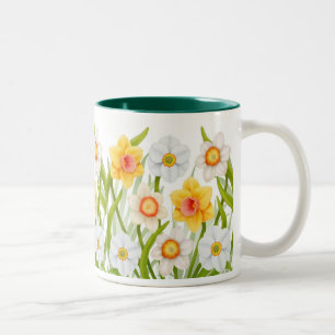 Taza alegre de los narcisos de la primavera