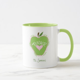 Taza Apple rosado y verde del cuarto profesor del grado
