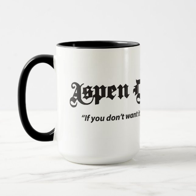 Taza Aspen Daily News 15 oz. Mug blanca con mango negro (Izquierda)