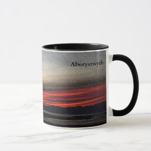 Taza Atardecer sobre el mar en Aberystwyth mug