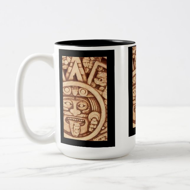 Taza azteca del detalle del calendario de AfriMex (Izquierda)