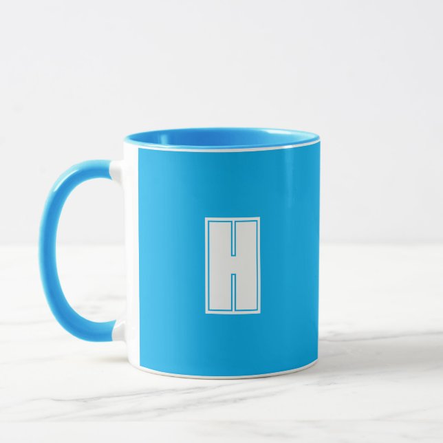 Taza azul brillante inicial blanco (Izquierda)