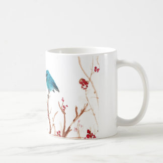 Taza azul del pájaro y de café de las bayas