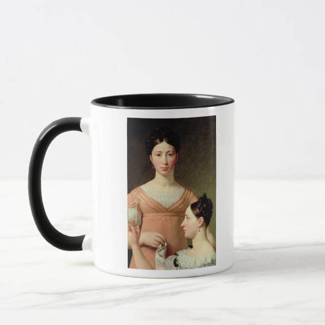 Taza Bella y Hanna Nathansson (Izquierda)