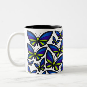 Taza Bicolor Alas verdes moradas azules ahora