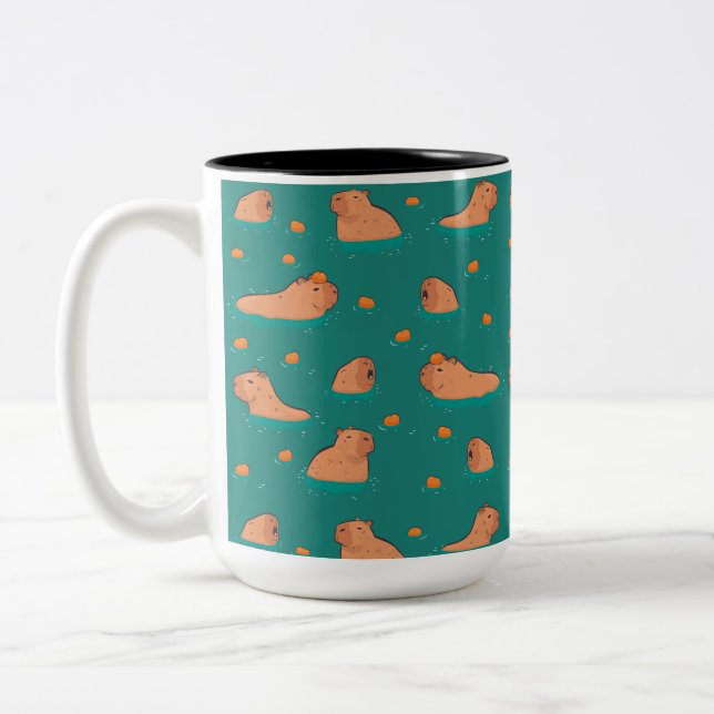 Taza Bicolor capibaras flotantes con naranja (Izquierda)
