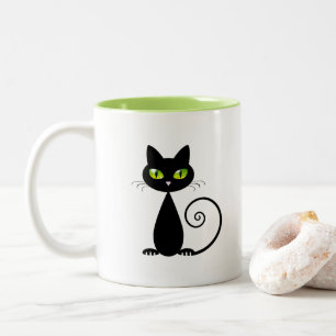 Taza Bicolor Cuidado gato negro con ojos verdes sentado en Guay