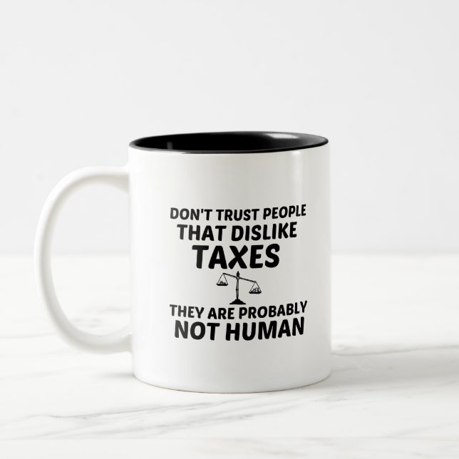 TAZA BICOLOR DISGUSTAR DE IMPUESTOS NO HUMANOS (Izquierda)