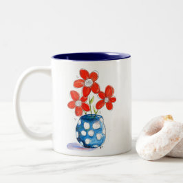 Taza Bicolor Flores de Naranja caprichosas en la malla azul
