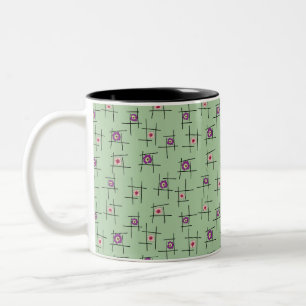 Taza Bicolor Flores geométricas y palos sobre fondo verde