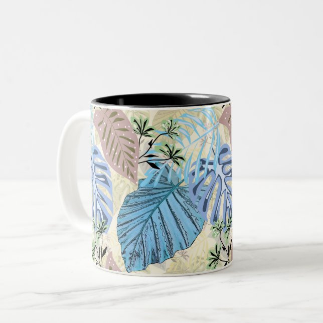 Taza Bicolor Hojas tropicales azules y violetas. (Anverso izquierdo)
