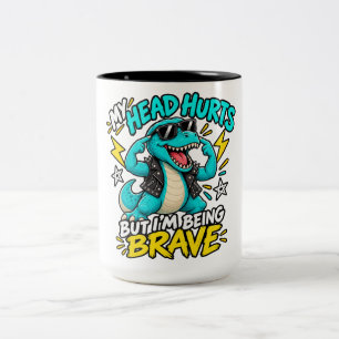TAZA BICOLOR ME DUELE LA CABEZA PERO ESTOY SIENDO VALIENTE