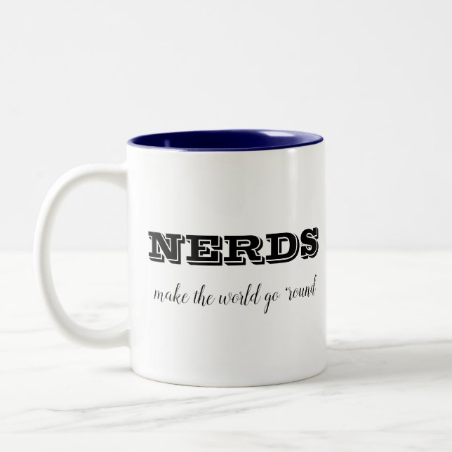 Taza Bicolor NERDS hacen que el mundo gire (Izquierda)