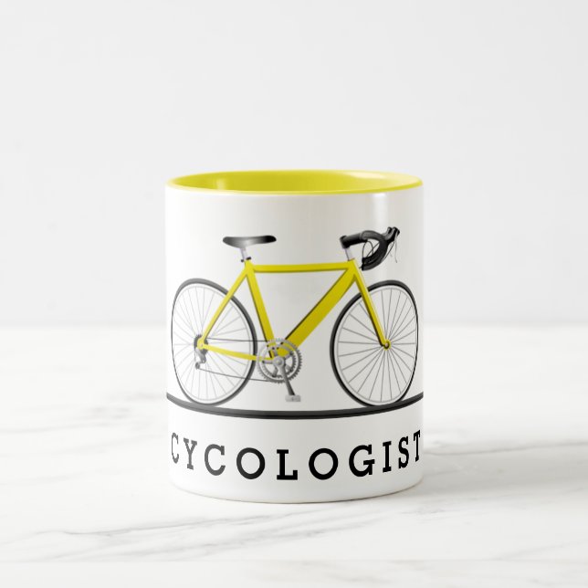 Taza Bicolor Texto cicólogo y bicicleta amarilla (Centro)