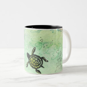 Taza Bicolor Tortuga odisea en un tazón de café