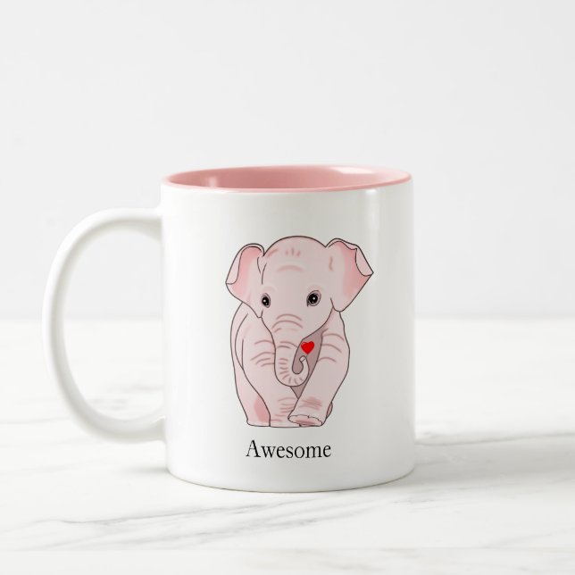 Taza Bicolor Un elefante rosado lindo sostiene un corazón (Izquierda)