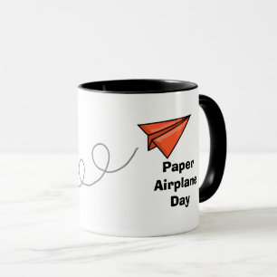 Taza Bomba del día del avión de papel