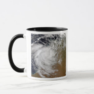 Taza Ciclón tropical Magda que viene en tierra en