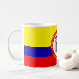Taza colombiana del escudo de armas de la bandera