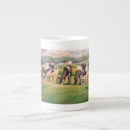 Taza con el pasto de vacas
