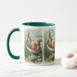 Taza Conejitos de Pascua antiguos en un barco con huevo