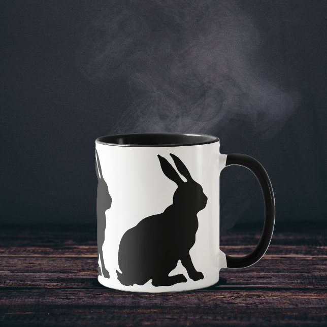 Taza Conejos Silueta Negra (Ring of sitting black silhouette rabbits with tall ears on white coffee or tea mug.)