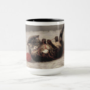 Taza Cuna de gato, un gato jugando con una bola de hilo