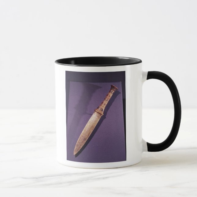 Taza Daga, de la tumba de Tutankhamun (Derecha)
