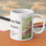 Taza De Café Abuelo te queremos foto y nombres personalizados<br><div class="desc">Celebremos al abuelo con este diseño de fotos y nombres de firmas personalizados. Puedes agregar dos fotos de un nieto o nieto, personalizar la expresión "Te amo" o "Te queremos", y personalizar si se llama "Abuelo", "Pop Pop", etc. También puedes añadir los nombres y el año del nieto o nieto...</div>