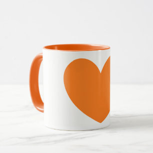 Taza de café anaranjada grande linda de la